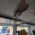 After - Dual Garage Door Installation with Genie Openers and Glass Panels