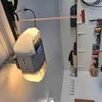 After - Insulated Garage Door Replacement with Modern Almond Raised Panel Design