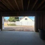 Before - Multi-Door Garage Installation with Smart Openers for Commercial Building