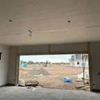 Before - Multiple CHI Raised Panel Garage Door Installation for Global Preservation Construction