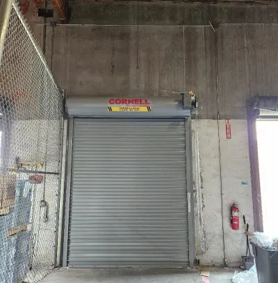 Commercial roll-up door closed in warehouse